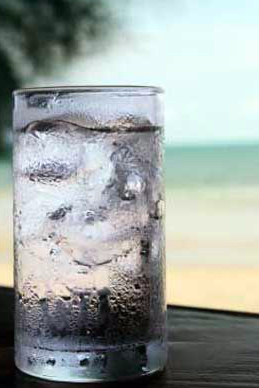 When ice melts and cools the surrounding water will the overall entropy change be positive or negative?